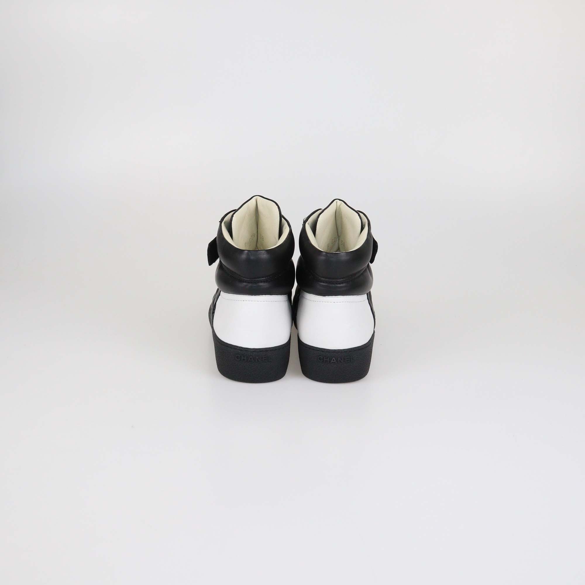 Chanel Black/White Quilted Leather CC High Top Sneakers