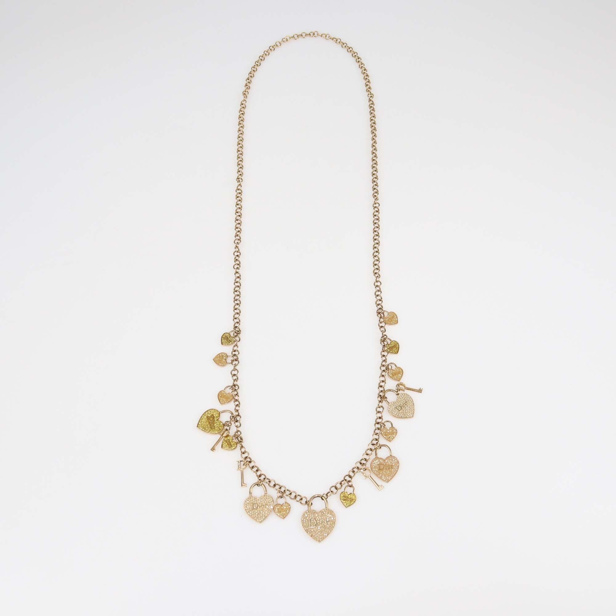 Christian Dior Gold Tone Crystal Heart and Key Multi Charms Long Necklace Womens Christian Dior 