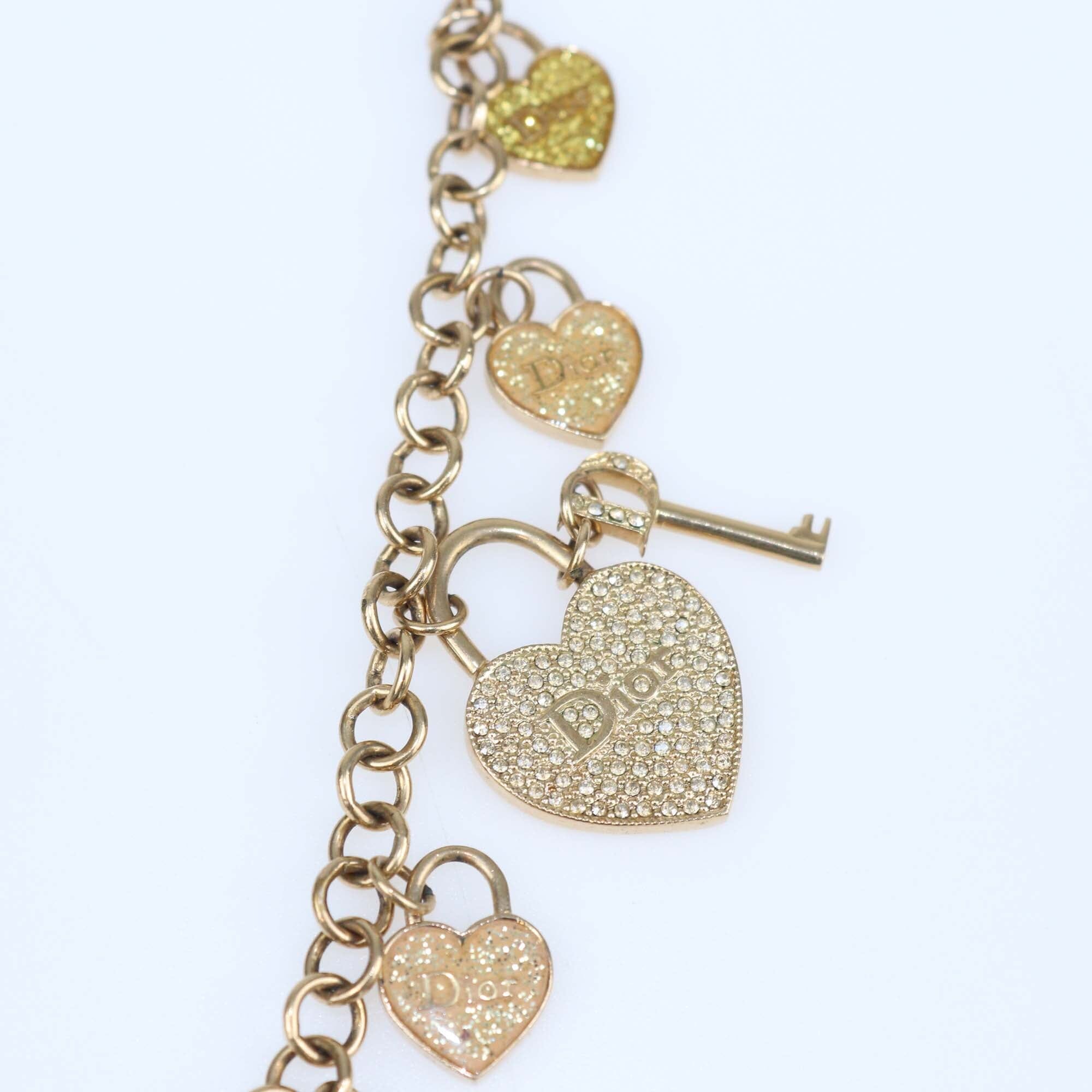 Christian Dior Gold Tone Crystal Heart and Key Multi Charms Long Necklace Womens Christian Dior 