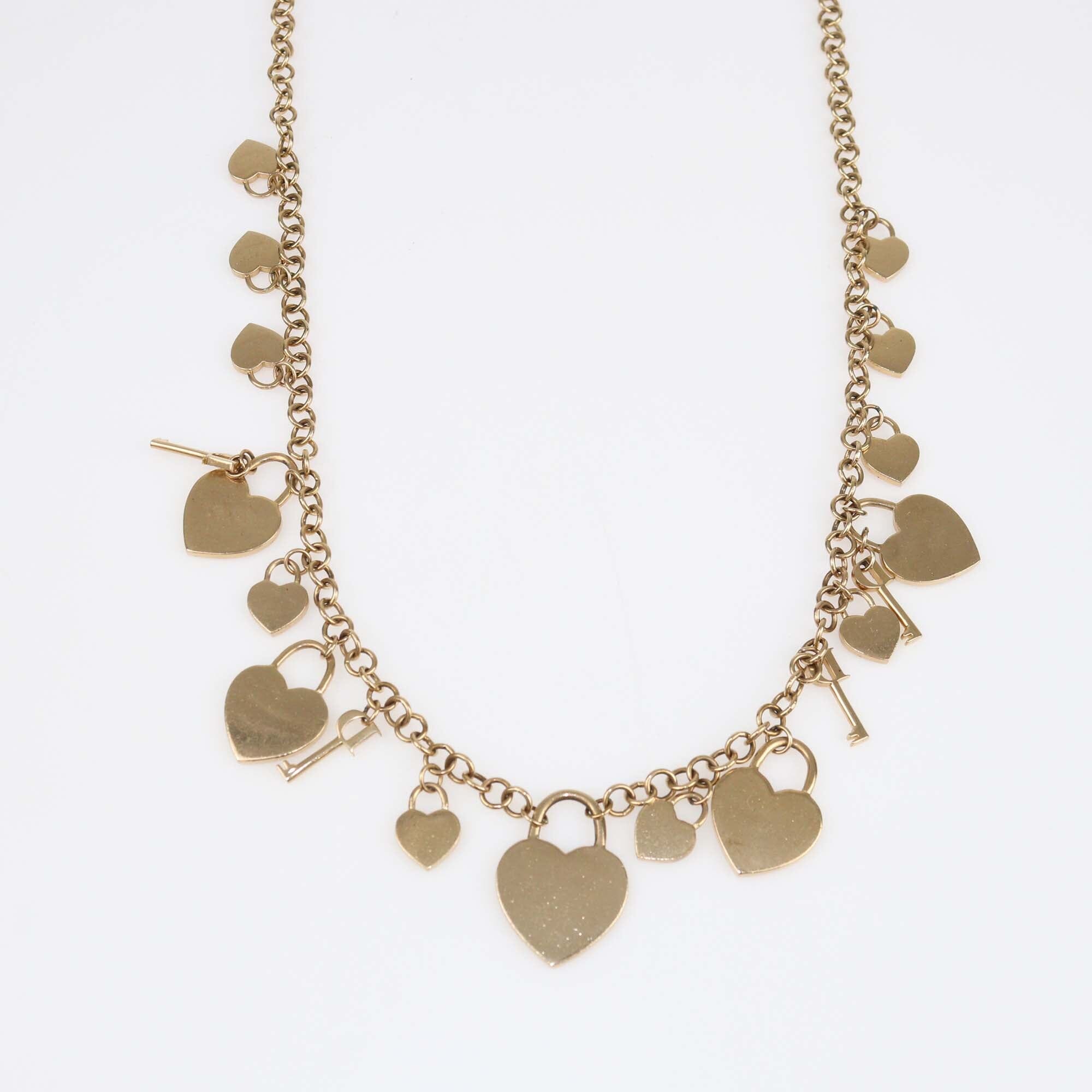 Christian Dior Gold Tone Crystal Heart and Key Multi Charms Long Necklace Womens Christian Dior 