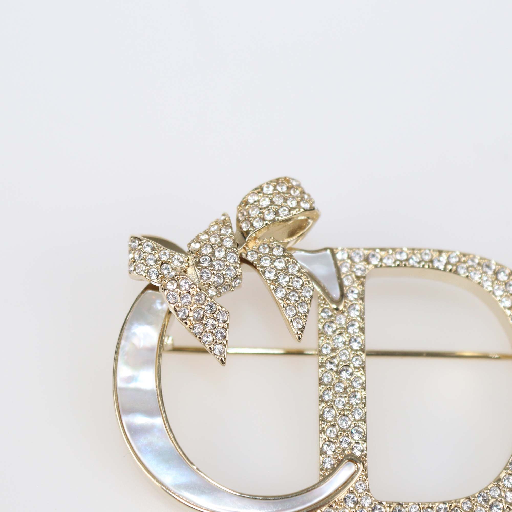 Christian Dior Gold Finish Metal Mother of Pearl Dior Shiny Bow Brooch